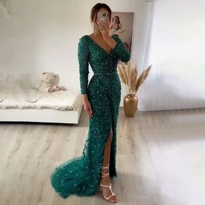 Emerald green long sleeve, beaded evening gown